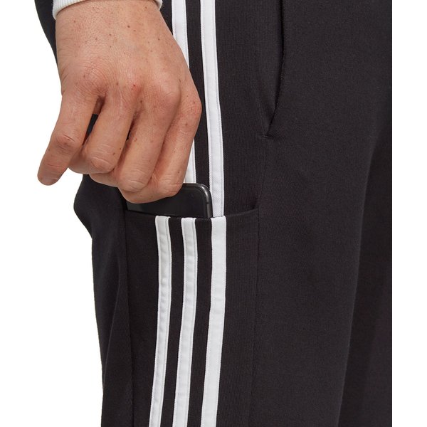 Spodnie dresowe męskie Essentials Stingle Jersey Tapered Open Hem 3-Stripse Adidas - czarne