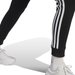 Spodnie dresowe damskie Essentials 3-Stripes Fleece Adidas - czarne