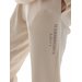 Spodnie dresowe damskie 4FWSS24TTROF665 4F - kremowy