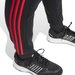 Spodnie dresowe męskie Essentials Fleece 3-Stripes Tapered Cuff Adidas - czarne/czerwony