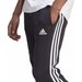Spodnie dresowe męskie Essentials Fleece 3-Stripes Tapered Cuff Adidas - czarne